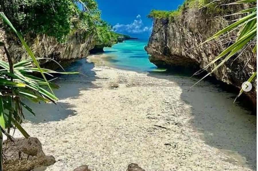 Kuza Cave, Hidden Mtende Beach & The Rock Restaurant - Mtende Beach, cliffs, coral flats, and changing tides