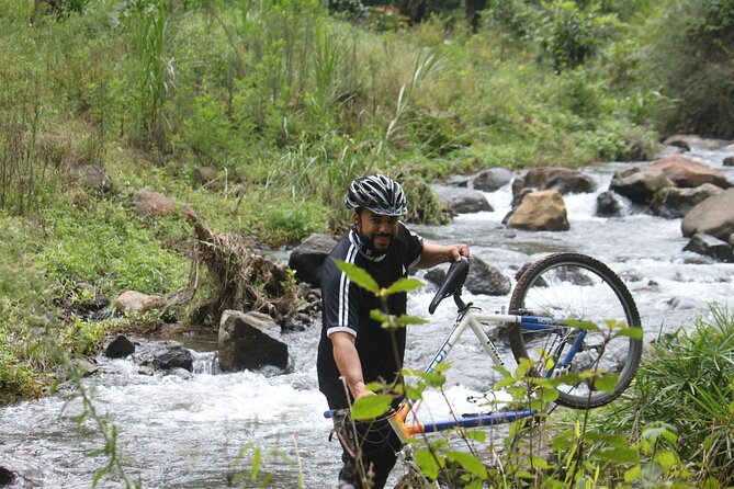 Materuni Village Tour | Materuni waterfalls | materuni coffee tour - Swimming beneath the falls