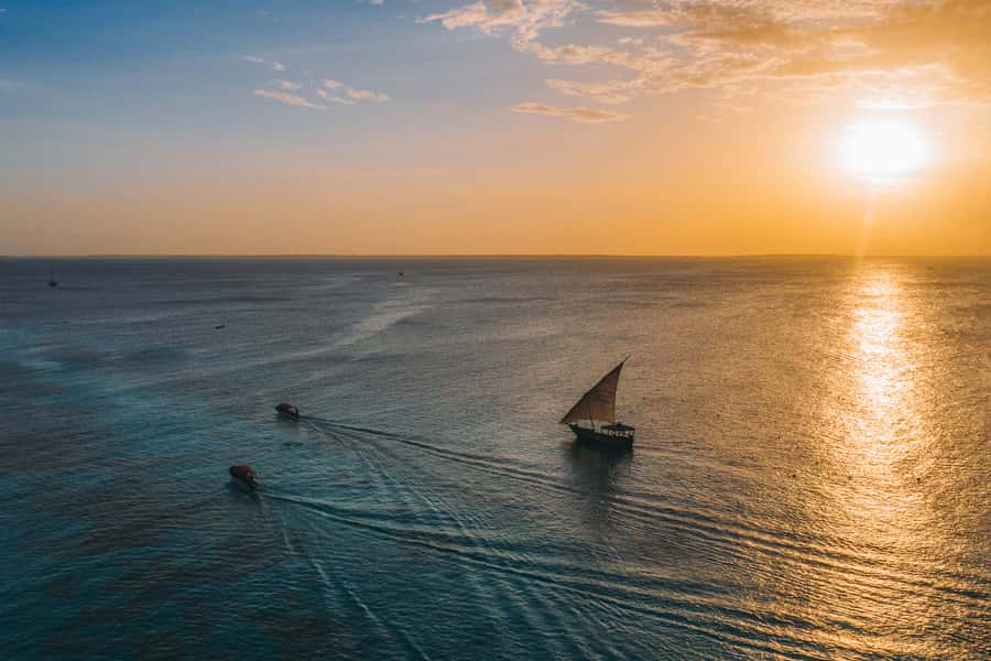 Zanzibar City: Sunset Sailing Tour with Snacks and Drinks - Guide support and the feel of the outing